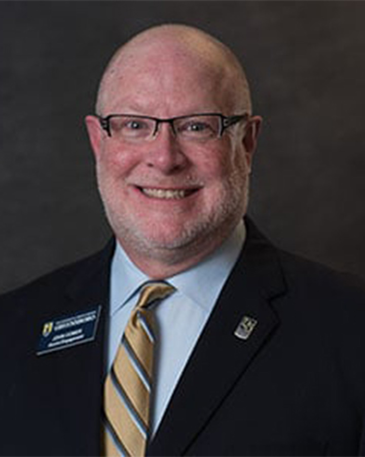 Portrait of UNCG's Alumni House Manager John Comer.