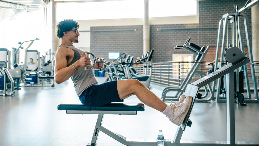 A man on a workout machine.