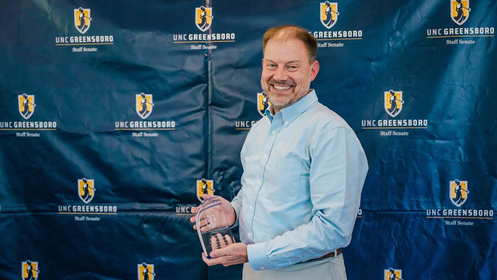 Ian Draves poses with his award.
