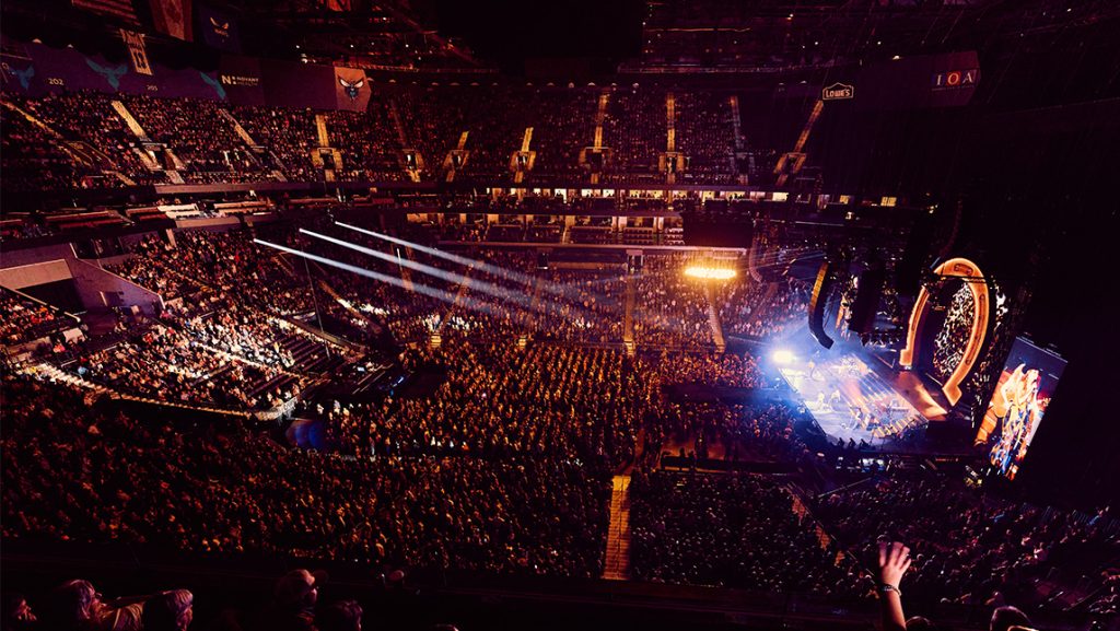 Wide shot of packed arena during a Lainey Wilson concert.