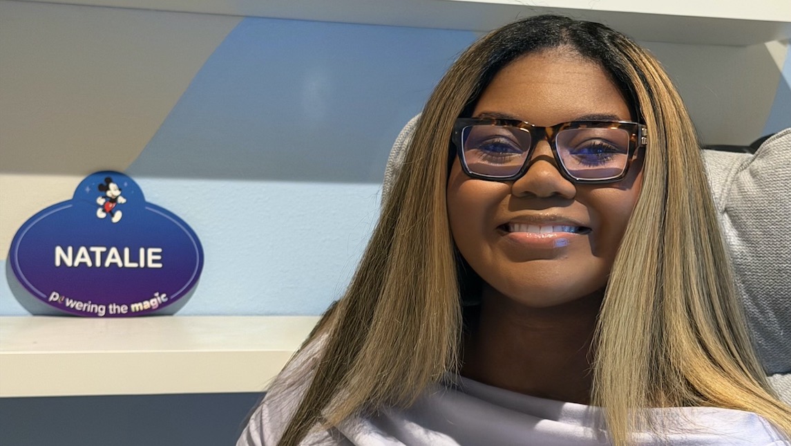 UNCG BSBE alumna, Natalie Tucker at her desk at Disney headquarters.