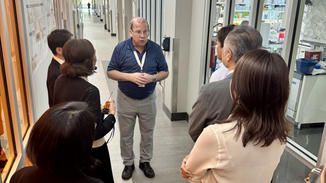 A JSNN professor speaking with a group of people during community outreach program.