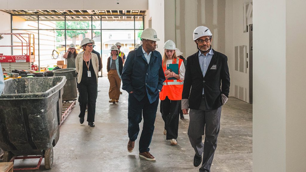 UNCG Chancellor Gilliam and Provost Boyette walk through construction.