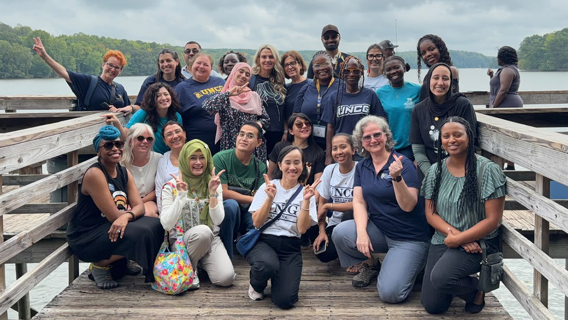 A large group of people on a pier.