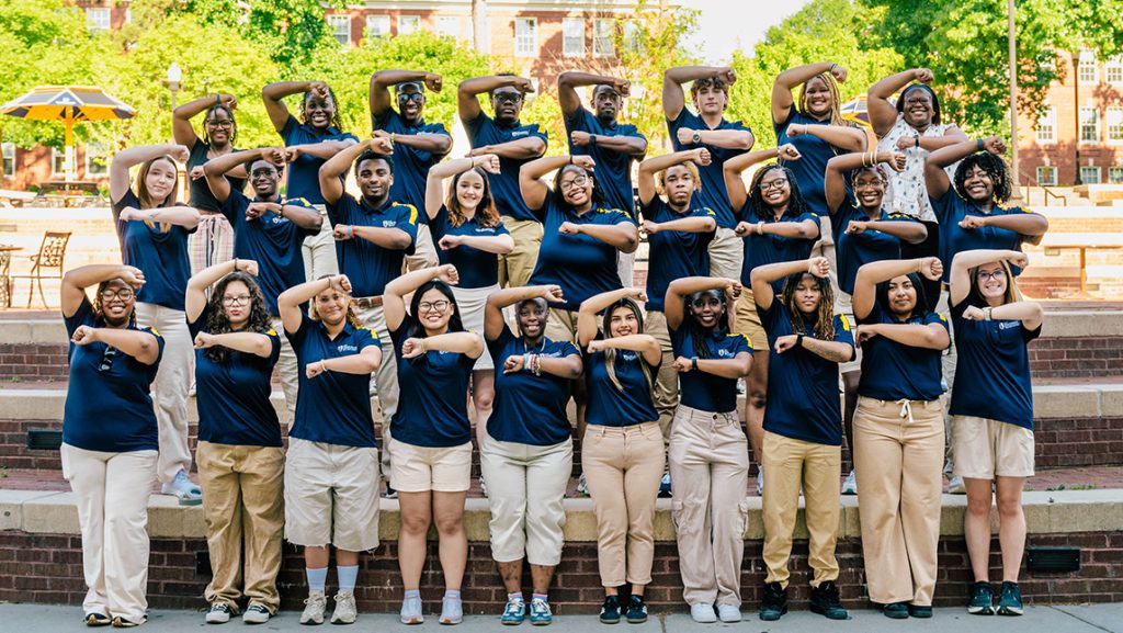 Group picture of UNCG Spartan Orientation students on steps outside.