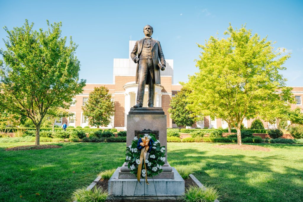 The bronze tatue of Charles Duncan McIver, the founder of the University, that looks upon Kaplan Commons