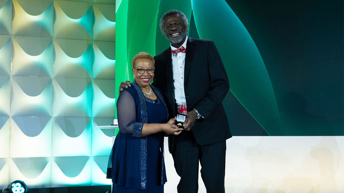 Dr. Ernest Grant and UNCG Dean Debra Barksdale onstage.