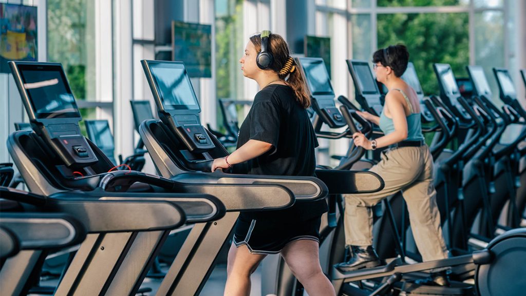 Two people on treadmills.