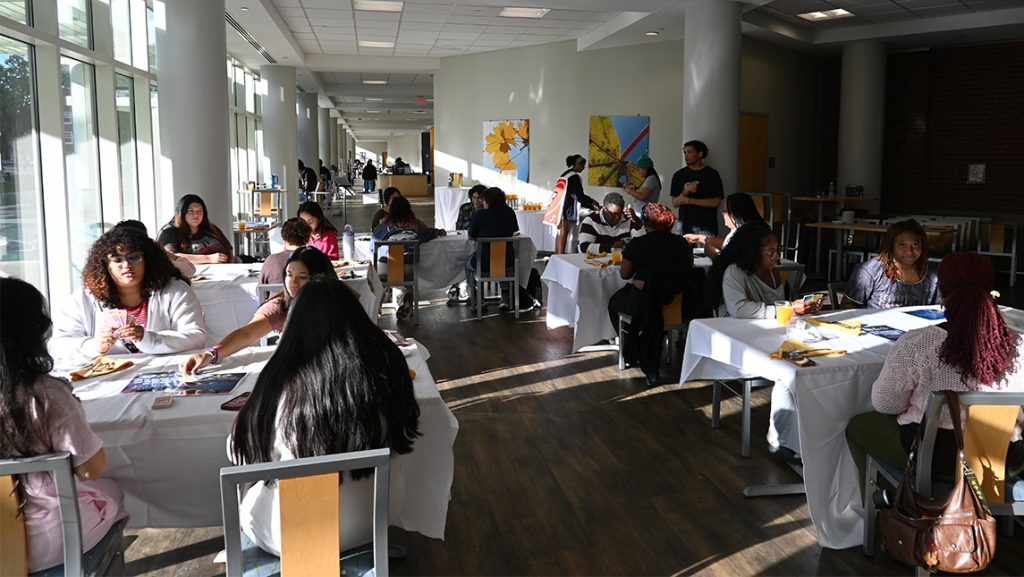 Students mill about UNCG Fountain View Dining Hall.