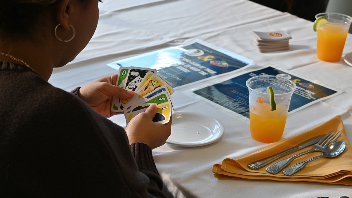 Close-up on a hand of UNO cards.